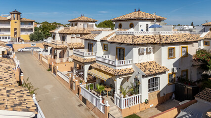 Spanish style homes with balconies and tiled roofs
