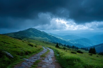 Stone path ascending green mountain storm clouds overhead distant peaks