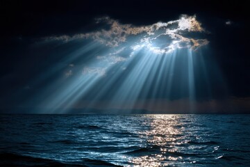 Sun rays pierce through clouds reflecting on the oceans dark surface