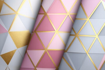 Three rolls of geometric patterned wallpaper with gold lines and pastel triangles