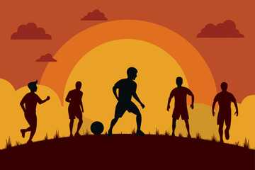 Fototapeta premium Silhouettes of soccer players playing on a hill at sunset