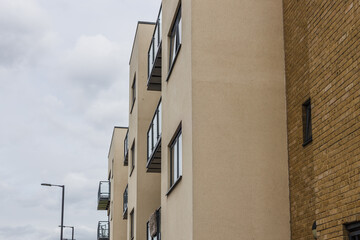 Modern apartment facade with balconies and windows