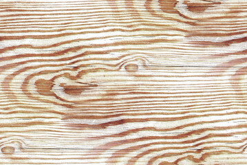 A close-up of wood grain. The wood is light brown with darker, swirling patterns and knots.