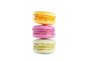 Stack of colorful French macarons isolated on white background.