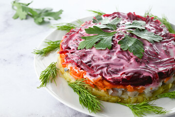 Traditional Russian Salad with Beets, Potatoes, Carrots, Herring, and Mayonnaise on White Background