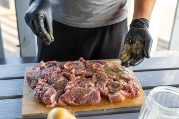 A man cutting meat. Selective focus.