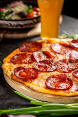 close-up of pepperoni pizza with melted cheese and salami slices