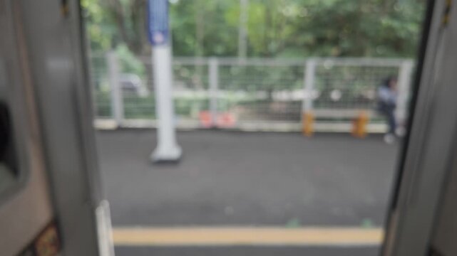 Train Ride - Blurred View from Inside a Moving Train. The train passing by in Depok City
