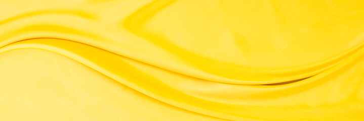 yellow gold satin texture that is white silver fabric luxurious shiny that is abstract silk cloth...