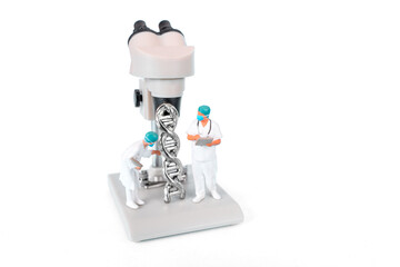 Microscope With DNA Helix And Scientists Analyzing Genetic Material