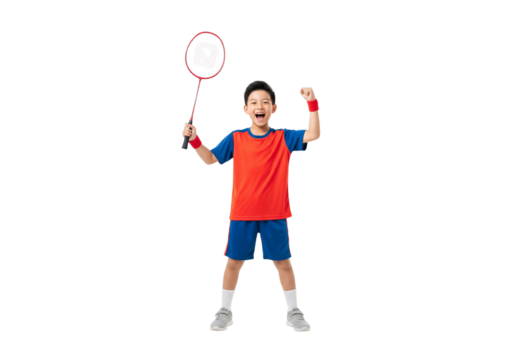 A joyful young badminton player celebrating a point with his racket raised high