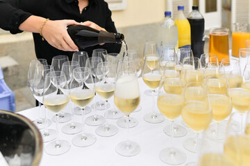 The waiters pouring champagne at a wedding