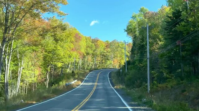 Cape Breton, Canada - September 30, 2025: Traveling by car on the unique Cabot Trail, a 300 km long panoramic road through Nova Scotia.