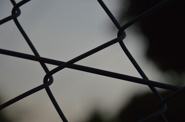 Minimalist Close-Up of Chain Link Fence at Dusk