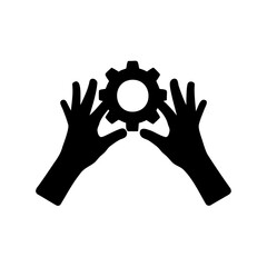 Silhouette of hands holding a cogwheel representing technology and manufacturing