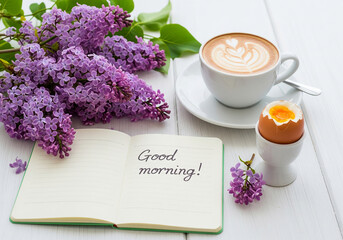 Morning coffee and breakfast with a "Good morning" message and spring flowers.