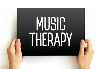 Music Therapy is the clinical and evidence-based use of music interventions to accomplish individualized goals within a therapeutic relationship, text concept on card