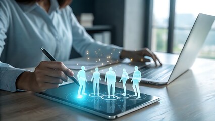 Businesswoman analyzing virtual people on a tablet, representing human resources and team management, with laptop on the table, recruitment concept