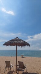 Parasols, chairs and tables on the beach