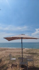 Parasols, chairs and tables on the beach