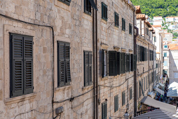 Stone facade with shutters close up