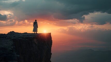 Dramatic sunset over mountain landscape with figure standing at edge, evoking contemplation and spiritual journey