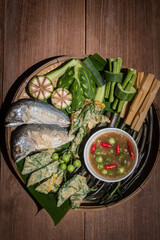 Thai shrimp paste chili dip with fried mackerel and boiled vegetables, traditional Thai food still life (Nam Prik Kapi)