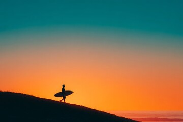 Silhouette of a surfer carrying board walking on a dune during sunset
