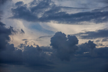 Dark storm clouds in an overcast sky. Dramatic heavenly background