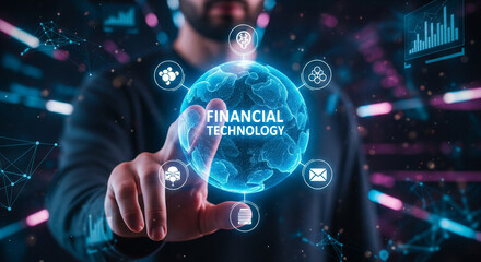 Fintech -financial technology concept. Young businessman select the icon Fintech on the virtual display