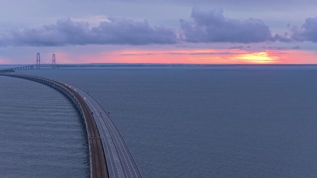 Morning light on Denmark Great Belt Bridge, aerial scene.