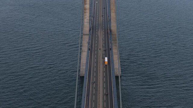 Great Belt Bridge with dense highway movement seen from drone.
