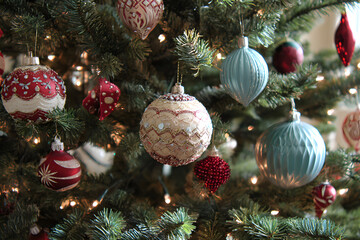 a christmas tree with ornaments hanging from it