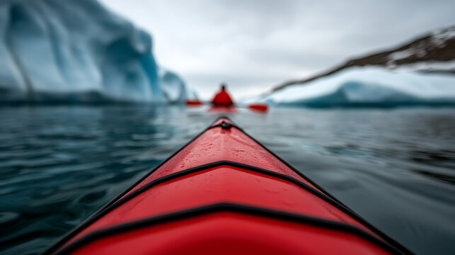Kayaking through icy waters with distant icebergs. A journey into serene landscapes on a cloudy day, experiencing nature's beauty from a unique viewpoint. - Powered by Adobe