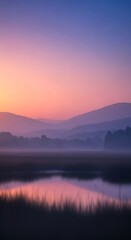Fototapeta premium Misty Landscape at Sunrise mountains lake fog nature dawn scenic tranquil peaceful reflection water sky pink purple blue gradient