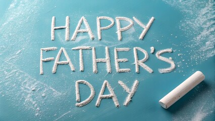 White powder carefully spells a celebratory message on a clear blue surface, with a chalk piece resting nearby.