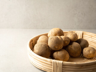 Potatoes on a wooden plate