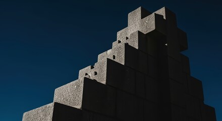 A concrete staircase with a dark blue sky background.