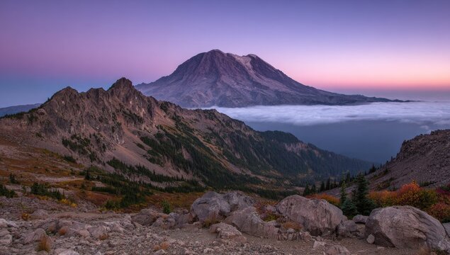 Mountain peak at dawn, shrouded in mist