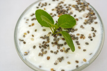 Chia pudding with mint on a white background. Space for text or design. Selective focus