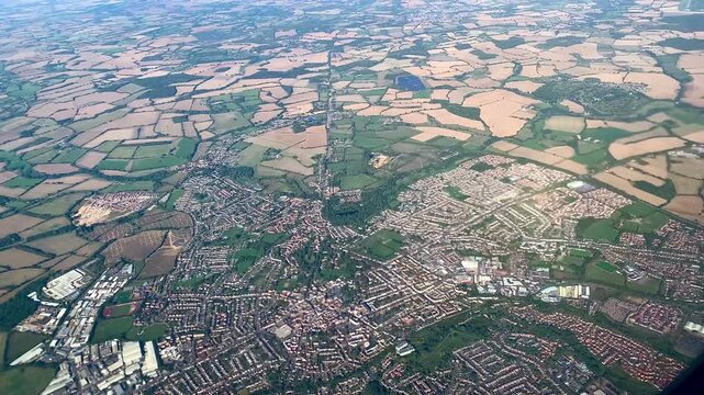 Aerial View Of East Anglia Countryside, Suburbs, British Farmland And Towns From Plane, Essex, Suffolk, Cambridgeshire Landscape Birds-Eye View, England