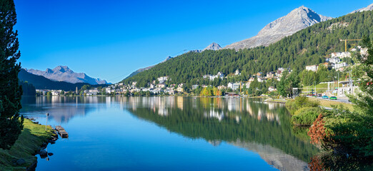 Panoramic view on a sunny morning across the lake to the famous resort of St. Moritz in autumn in the canton of Graub&uuml;nden, Switzerland