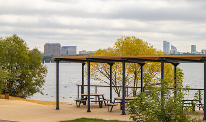 Stroginsky Bay view with waterfront pergola and picnic tables autumn day Moscow