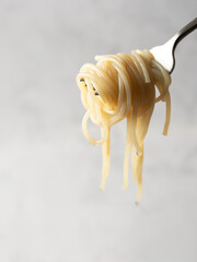 Boiled pasta on a fork