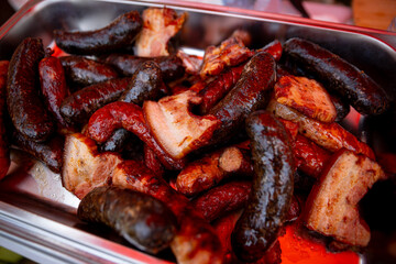 A Delicious and Mouthwatering Platter of Grilled Sausages and Various Meats Ready for Enjoyment