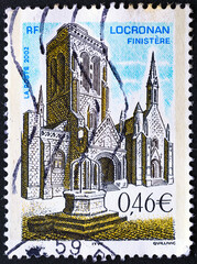 FRANCE-CIRCA 2002:The stamp depicts the Church of Saint Ronan in Locronan 2002.Philately.Postage stamps from different countries and times.A collection of world stamps.