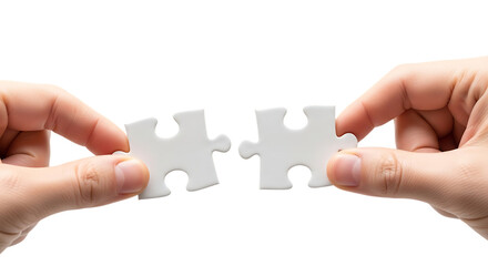 Hands holding two jigsaw puzzle pieces symbolizing connection and teamwork