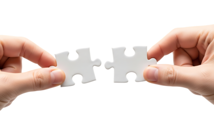 Hands holding two jigsaw puzzle pieces symbolizing connection and teamwork