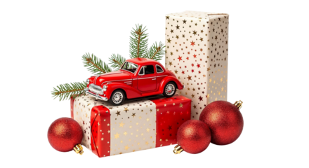 Red toy car on gift boxes with Christmas ornaments and evergreen sprig