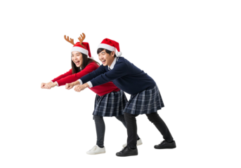 Playful students in festive costumes decorating Christmas tree